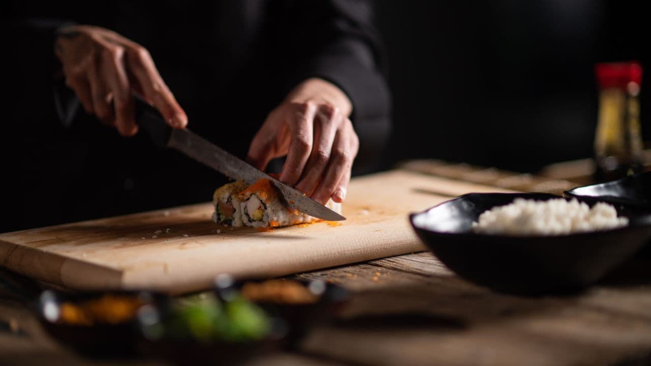 Chef preparing sushi with artistry